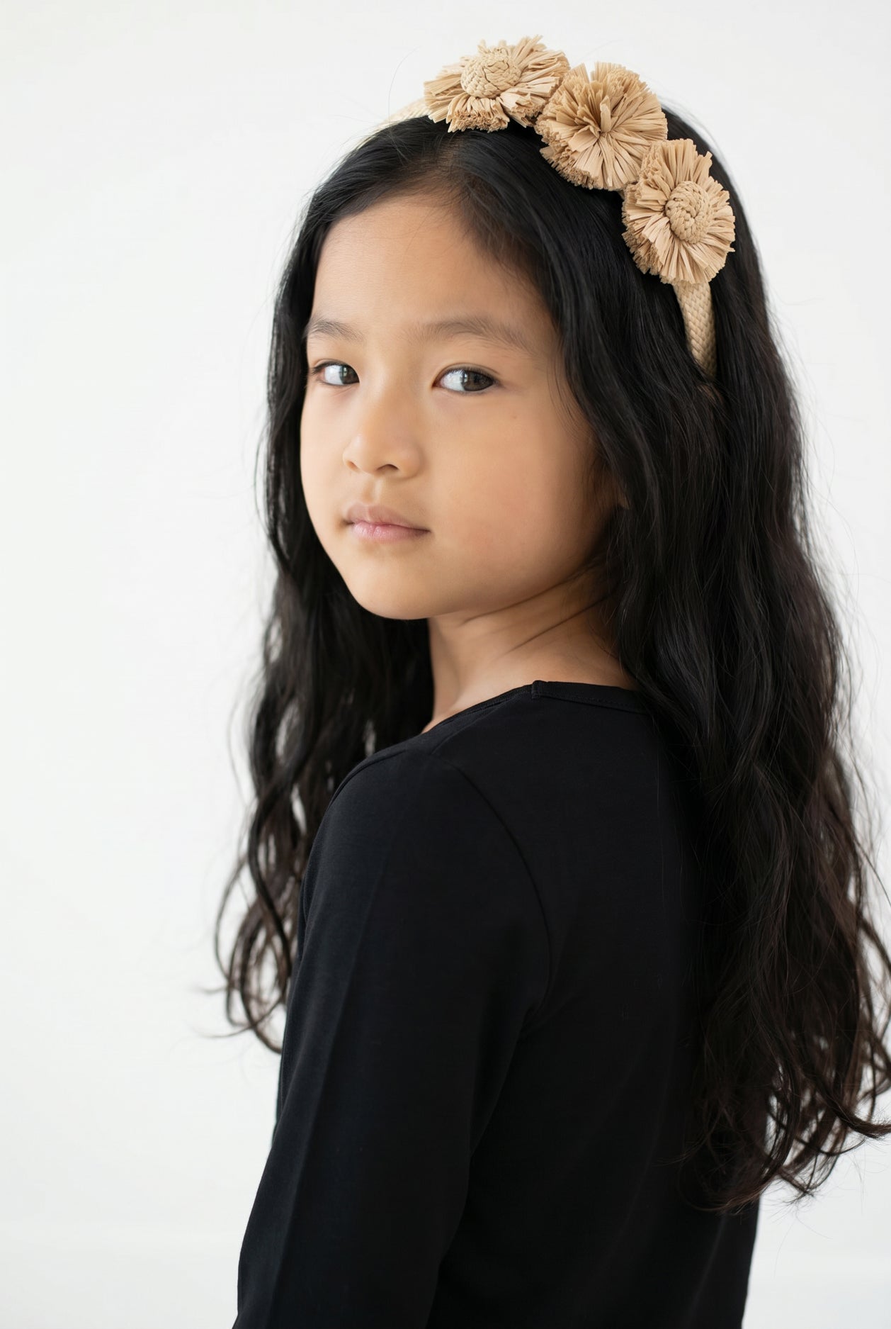 Model wearing the Girls' Nuggles® Essential 3/4 Tee in Black
