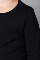 Model wearing the Girls' Nuggles® Essential 3/4 Tee in Black
