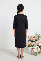 Model wearing Nuggles® Girls Midi Layering Dress in Black