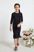 Model wearing Nuggles® Girls Midi Layering Dress in Black