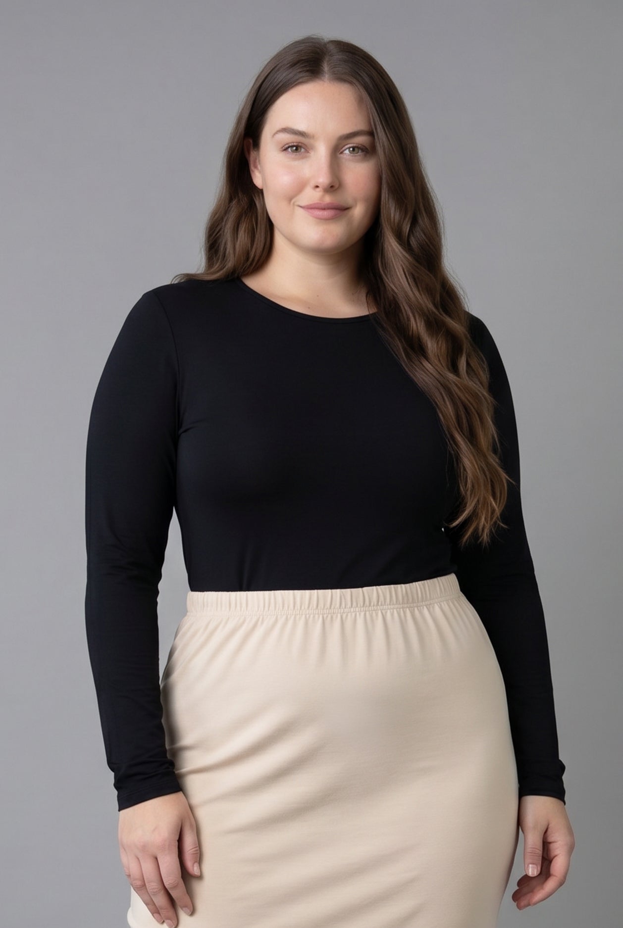Model wearing Nuggles® Long Sleeve Essential Tee in Black