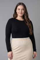 Model wearing Nuggles® Long Sleeve Essential Tee in Black