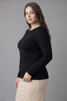 Model wearing Nuggles® Long Sleeve Essential Tee in Black