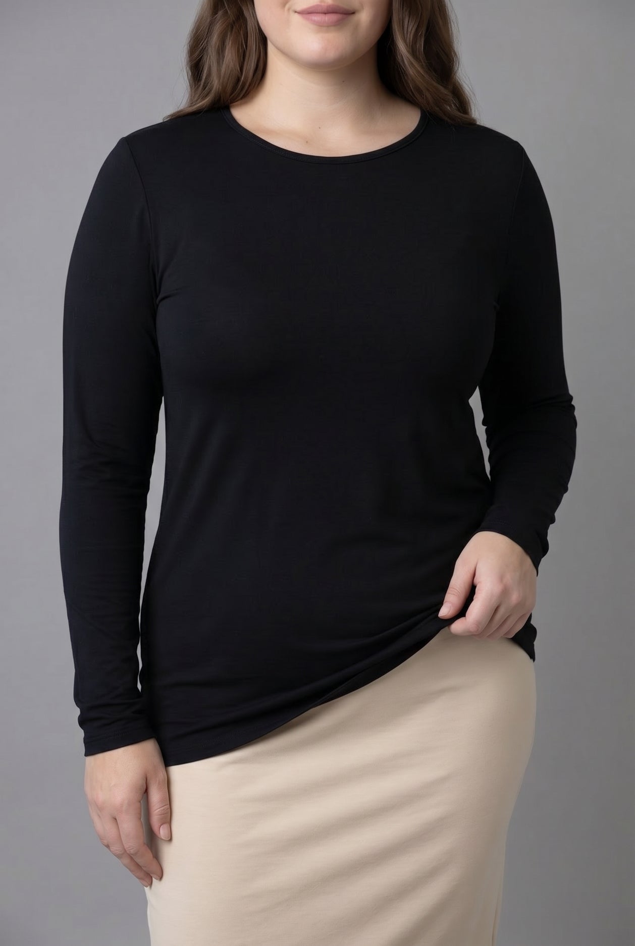 Model wearing Nuggles® Long Sleeve Essential Tee in Black
