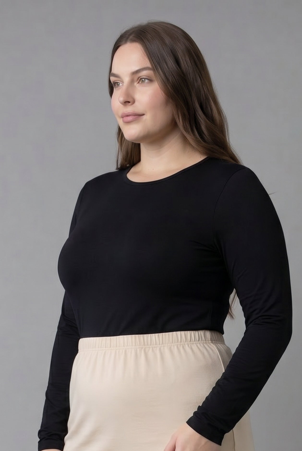 Model wearing Nuggles® Long Sleeve Essential Tee in Black