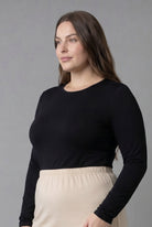 Model wearing Nuggles® Long Sleeve Essential Tee in Black