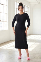 Model wearing Nuggles® Ribbed Midi Layering Dress in Black