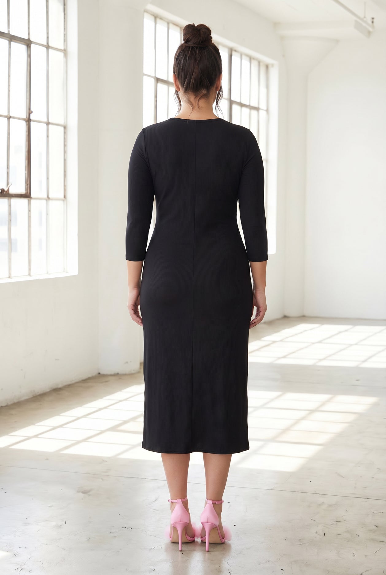 Model wearing Nuggles® Ribbed Midi Layering Dress in Black