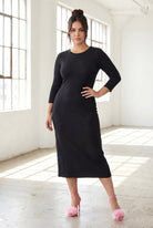 Model wearing Nuggles® Ribbed Midi Layering Dress in Black