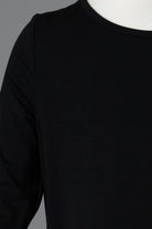 Model wearing Nuggles® Girls Midi Layering Dress in Black