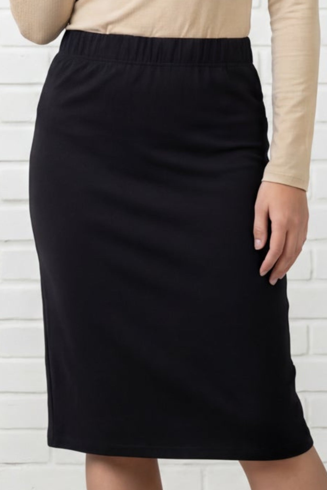 Model wearing Nuggles® Relaxed Midi Skirt in Black