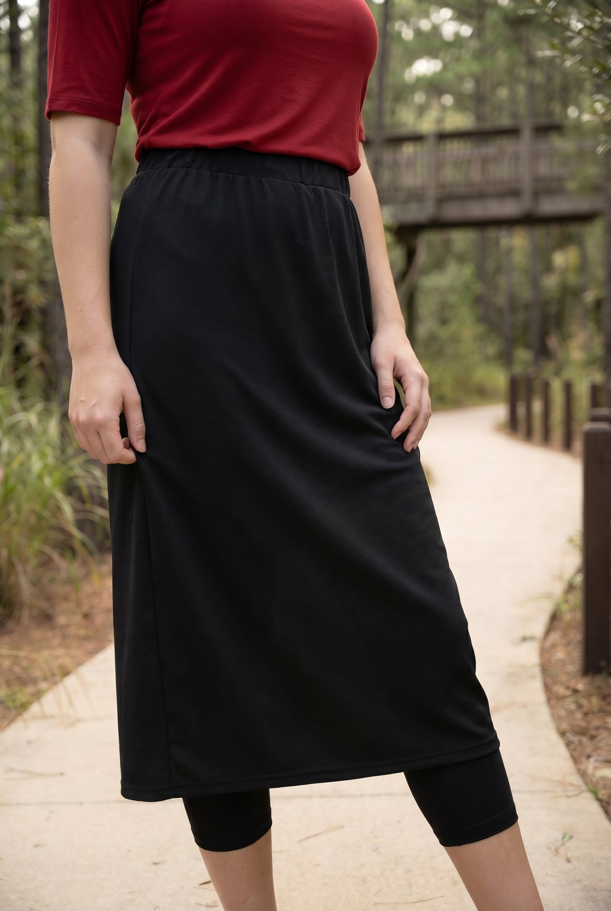 Model wearing Nuggles® 31" All-Sport Skirt in Black