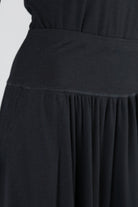 Model wearing Nuggles®  Bethany Shirt & Skirt in Black