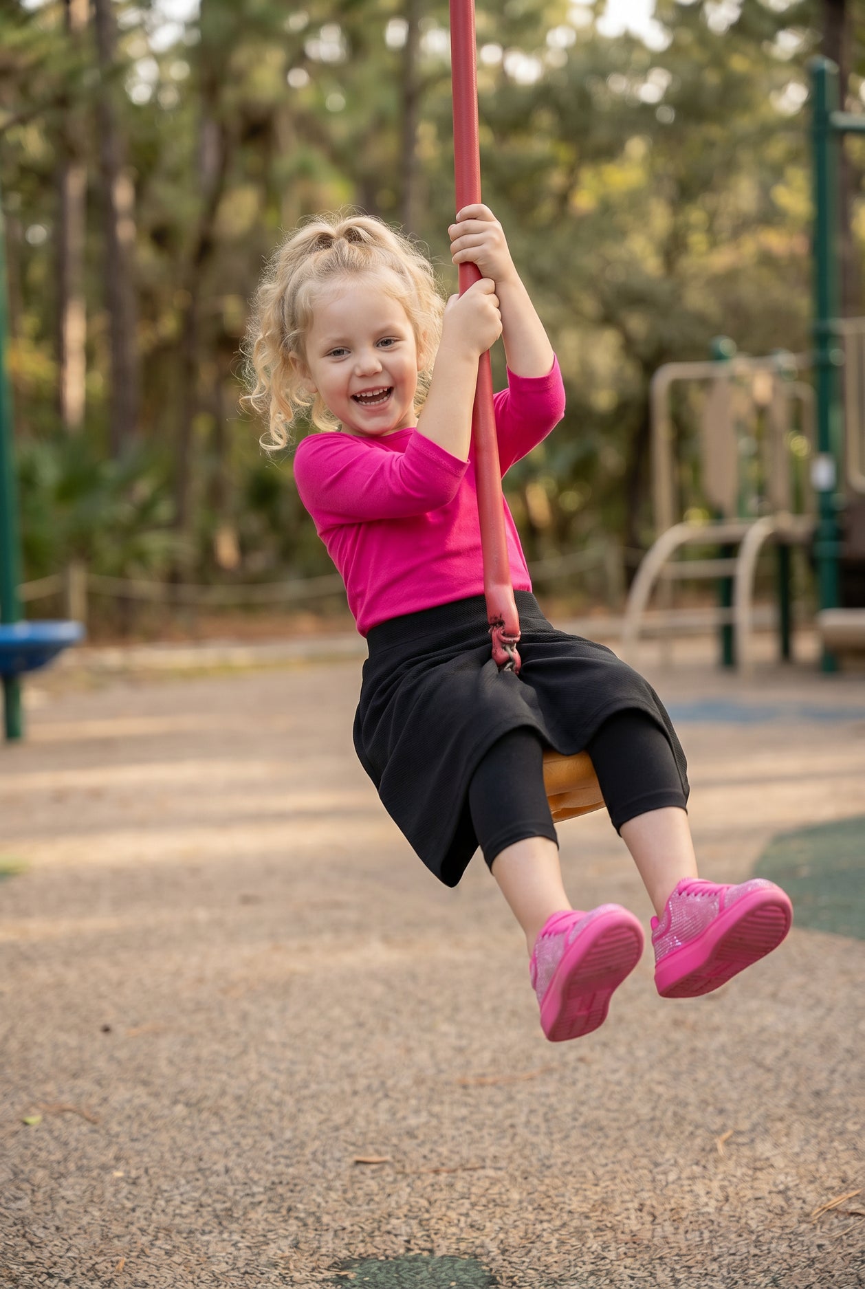 Model wearing Nuggles® Girls All-Sport Skirt in Black