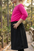 Model wearing Nuggles® Girls All-Sport Skirt in Black