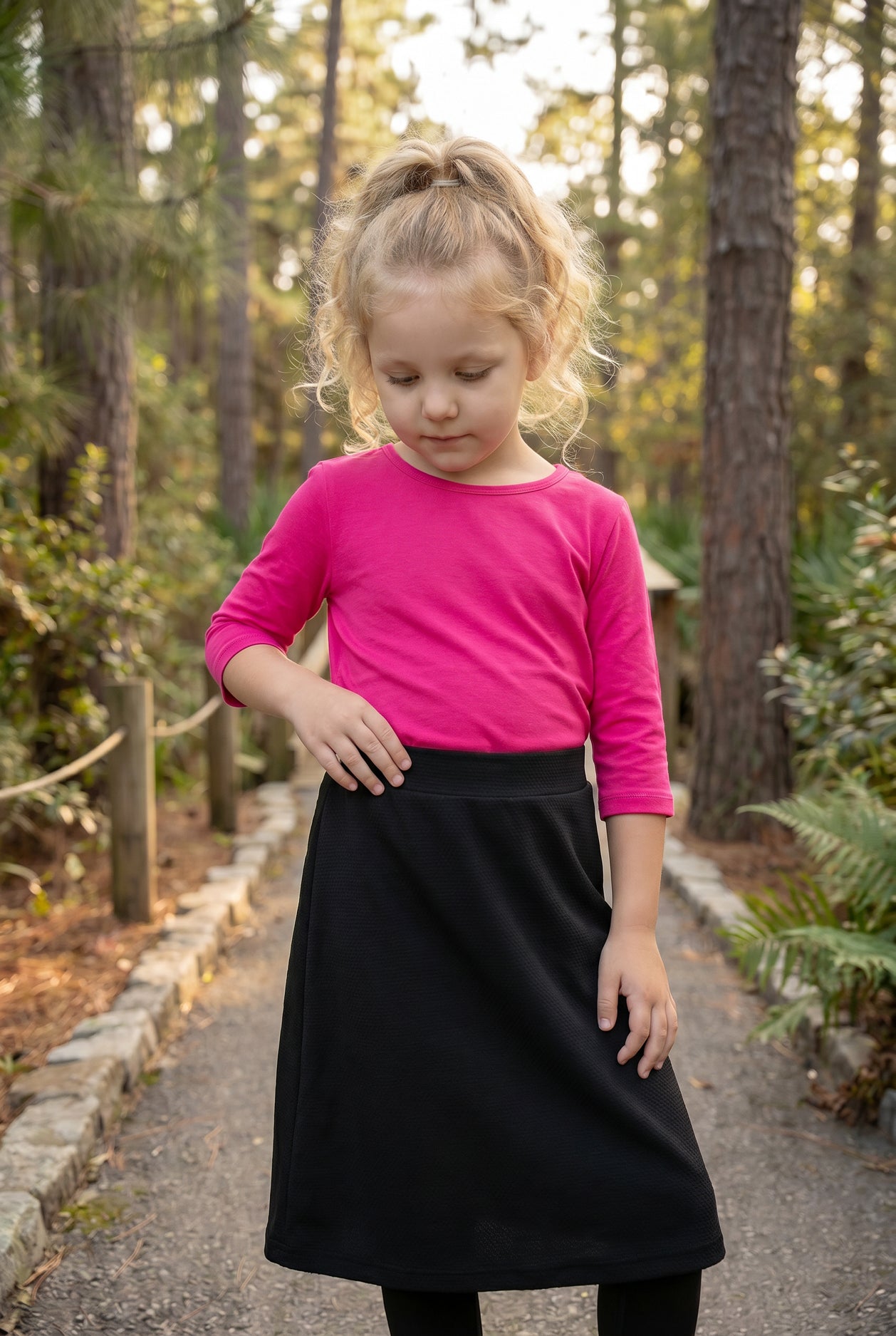 Model wearing Nuggles® Girls All-Sport Skirt in Black