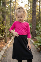 Model wearing Nuggles® Girls All-Sport Skirt in Black