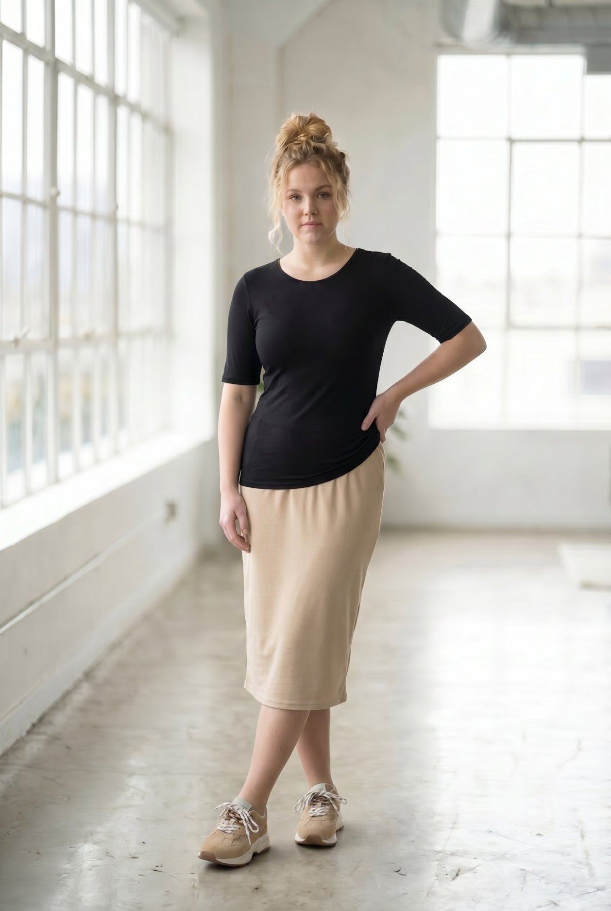 Model wearing the Nuggles® Essential Half Sleeve Tee in Black