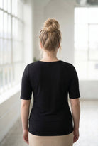 Model wearing the Nuggles® Essential Half Sleeve Tee in Black