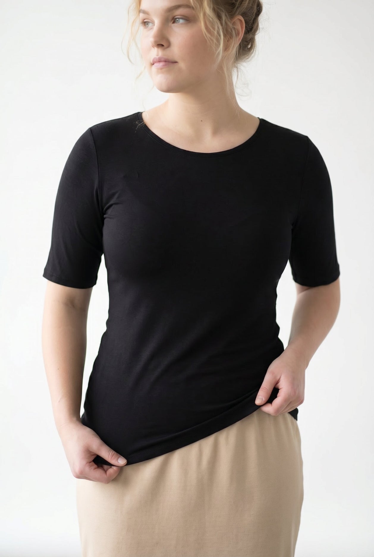 Model wearing the Nuggles® Essential Half Sleeve Tee in Black