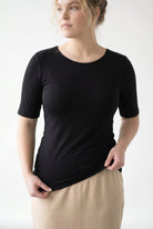 Model wearing the Nuggles® Essential Half Sleeve Tee in Black