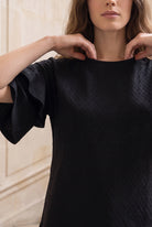Model wearing Nuggles®  Helena Top in Black