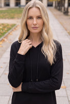 Model wearing Nuggles®   Hoodie Dress in Black