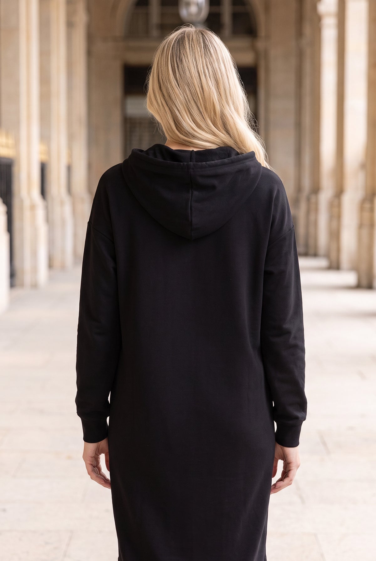 Model wearing Nuggles®   Hoodie Dress in Black