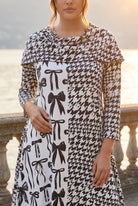 The Nuggles® Bailey Dress in Black Ribbon midi length, two tone with cowl neckline