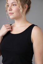 Model wearing Nuggles® Wide Neck Tank in Black