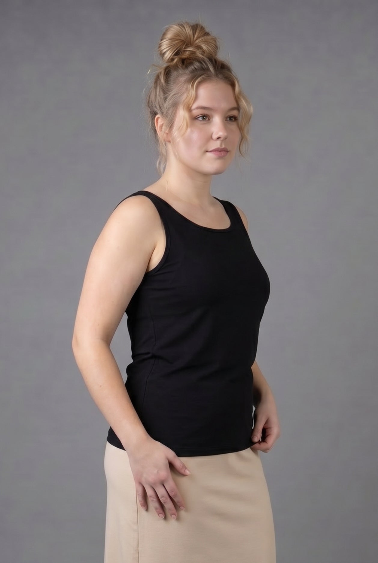Model wearing Nuggles® Wide Neck Tank in Black