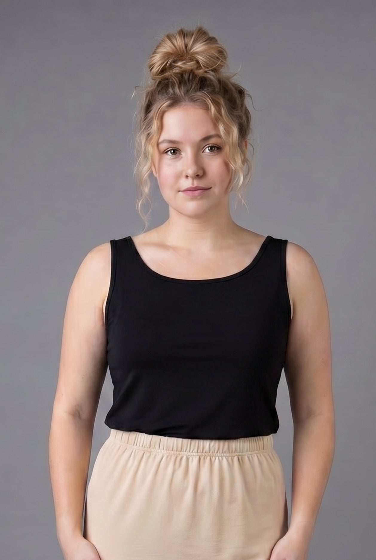 Model wearing Nuggles® Wide Neck Tank in Black