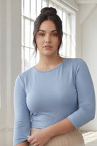 Model wearing Nuggles® 3/4 Essential Tee in Blue Pearl