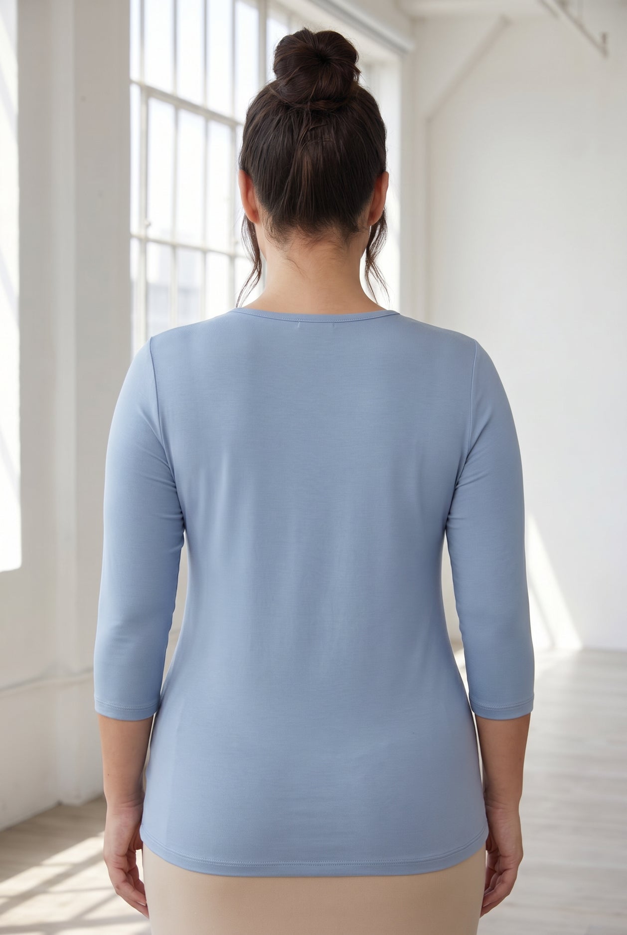 Model wearing Nuggles® 3/4 Essential Tee in Blue Pearl