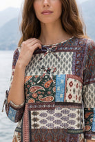 Model wearing Nuggles® Lexi Bow Top in Boho Patchwork