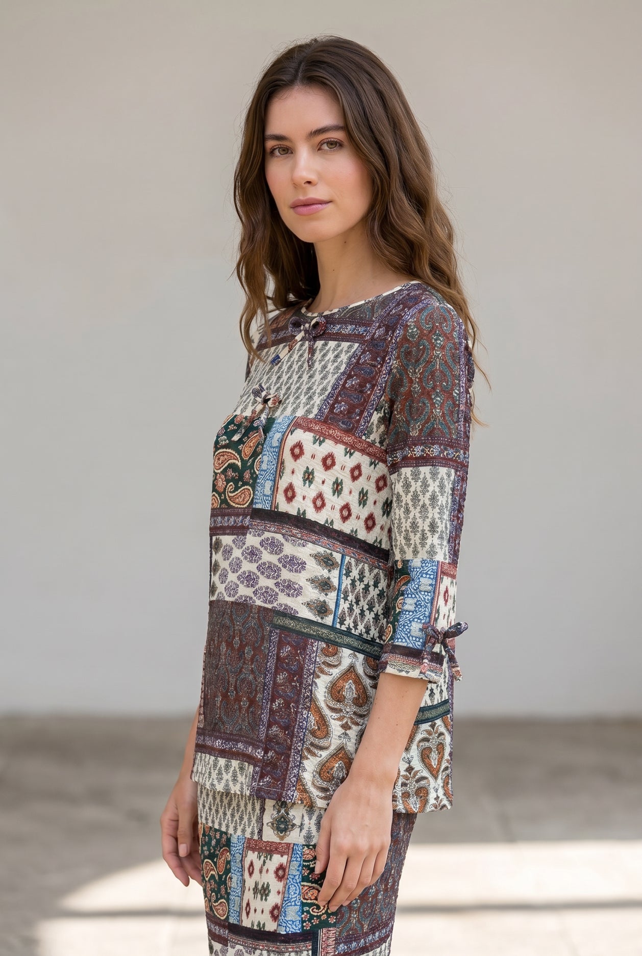 Model wearing Nuggles® Lexi Bow Top in Boho Patchwork