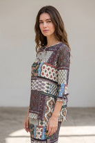 Model wearing Nuggles® Lexi Bow Top in Boho Patchwork