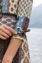 Model wearing Nuggles® Lexi Bow Top in Boho Patchwork