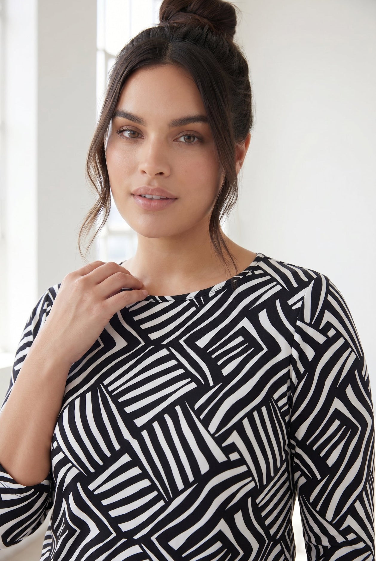 Model wearing Nuggles® 3/4 Essential Tee in Bold Lines