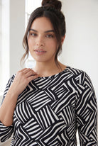 Model wearing Nuggles® 3/4 Essential Tee in Bold Lines
