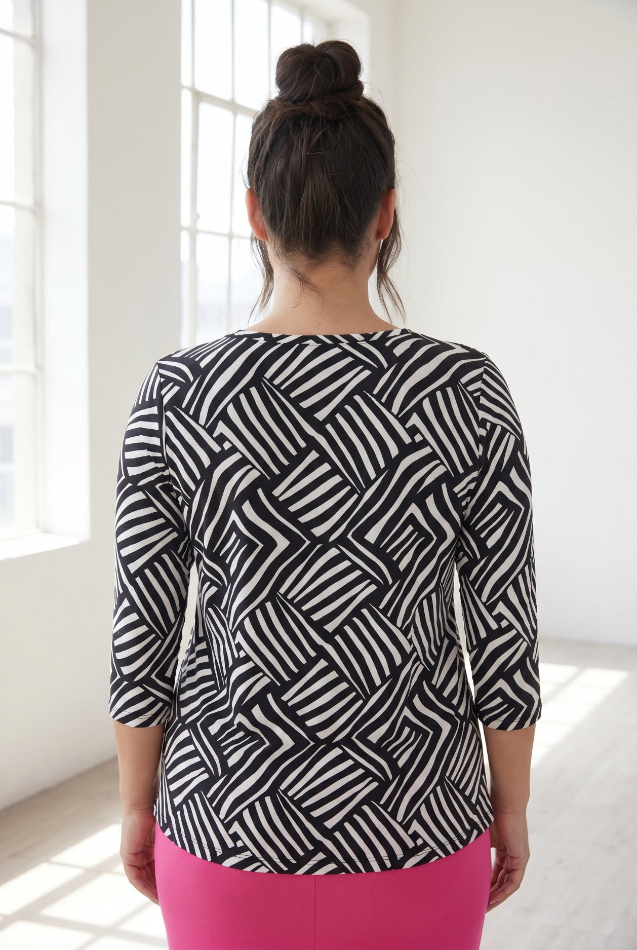 Model wearing Nuggles® 3/4 Essential Tee in Bold Lines