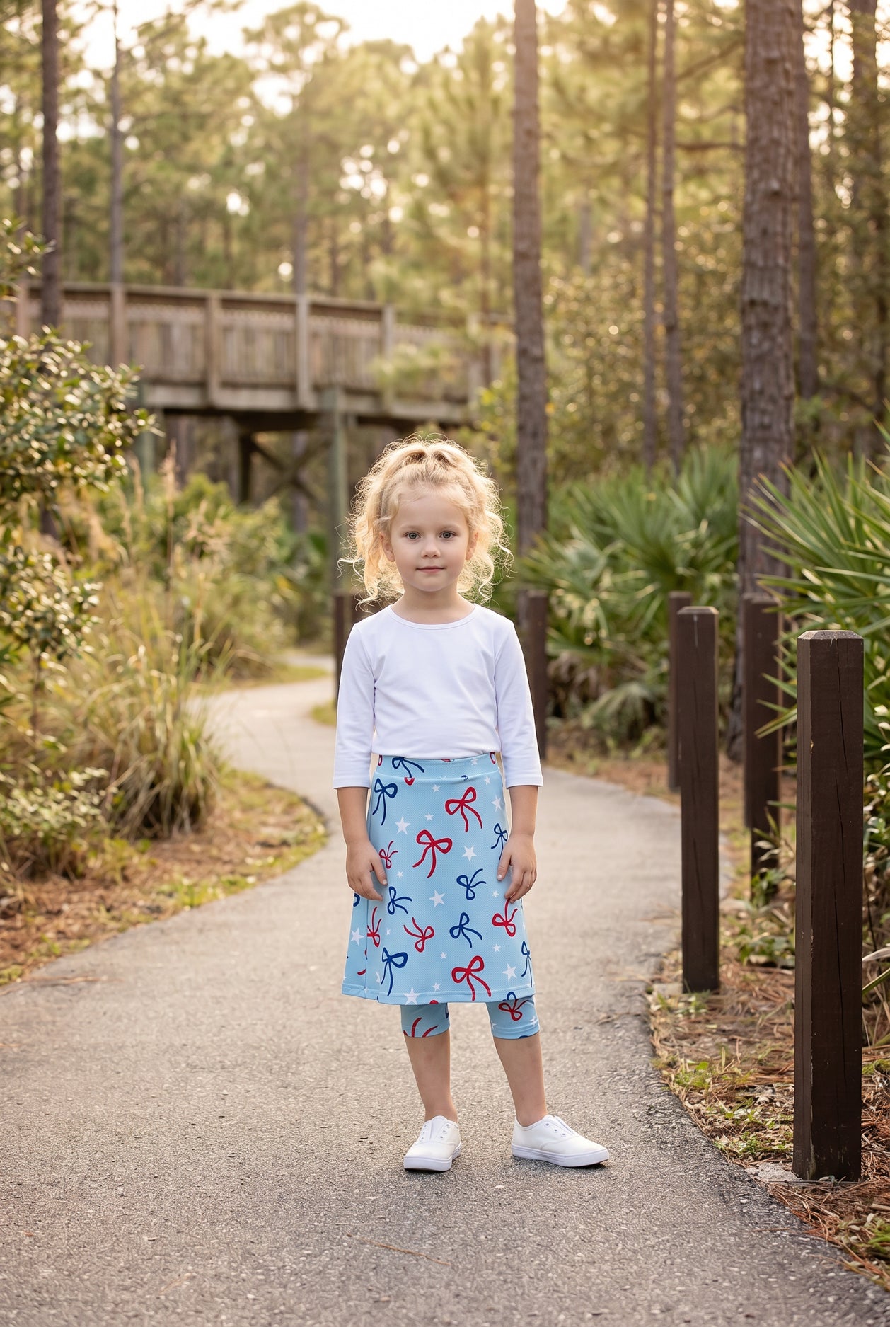 Model wearing Nuggles® Girls All-Sport Skirt in Bow Active
