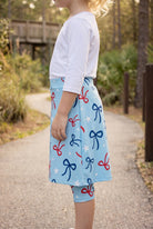 Model wearing Nuggles® Girls All-Sport Skirt in Bow Active