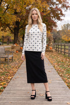 Model wearing Nuggles®  Long Sleeve Essential Tee in  Bow Check