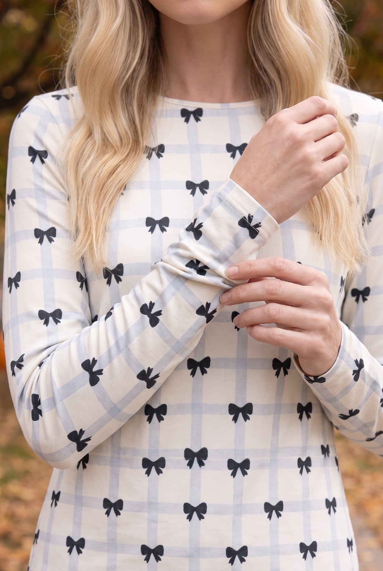 Model wearing Nuggles®  Long Sleeve Essential Tee in  Bow Check