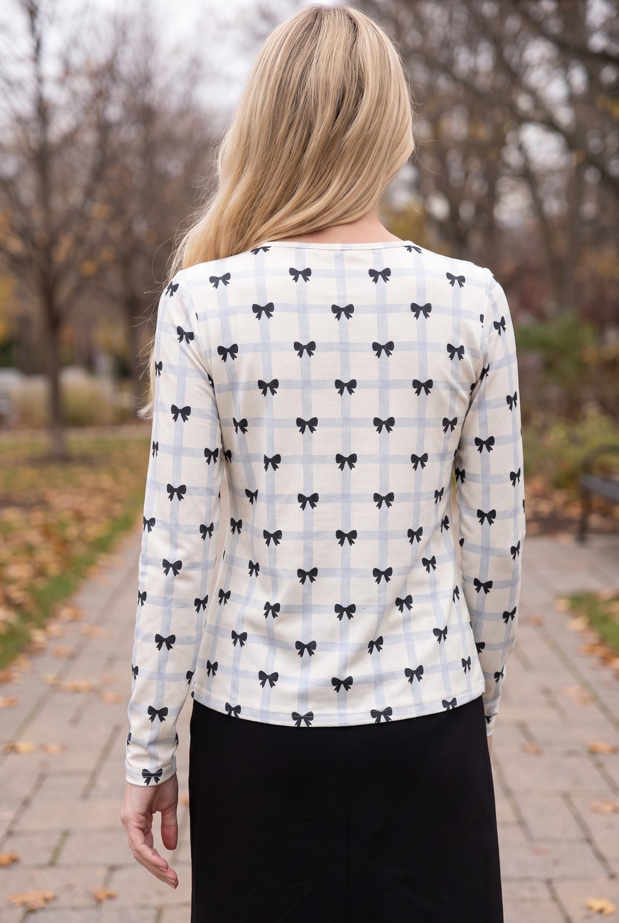 Model wearing Nuggles®  Long Sleeve Essential Tee in  Bow Check