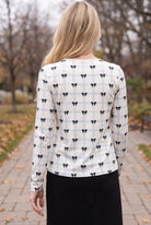 Model wearing Nuggles®  Long Sleeve Essential Tee in  Bow Check