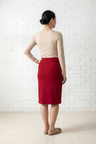 Model wearing Nuggles® 25" Relaxed Midi Skirt in Brick Red