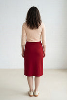 Model wearing Nuggles® 27" Relaxed Midi Skirt in Brick Red