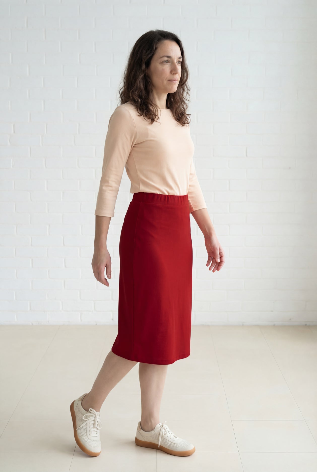 Model wearing Nuggles® 27" Relaxed Midi Skirt in Brick Red